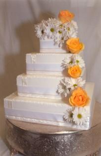 4-tier white wedding cake by Jasmine Bojic