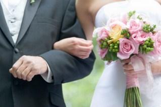 father escorting bride down aisle