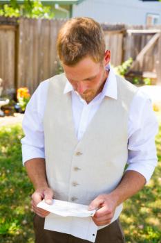 Groom reading letter
