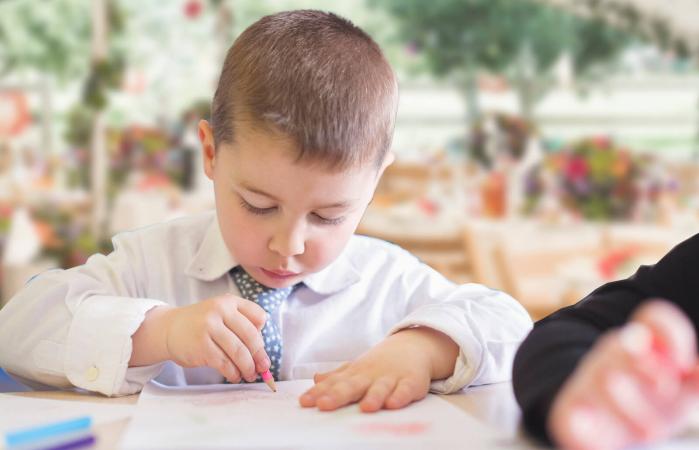 child coloring at wedding
