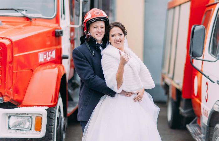 couple in front of fire truck