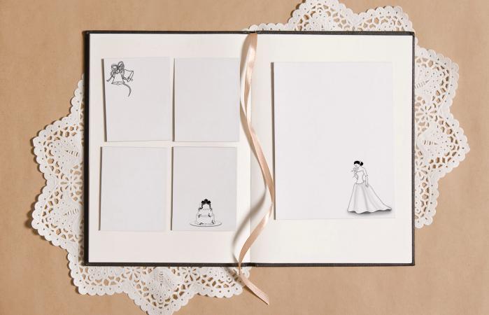 Open photo album with gold ribbon