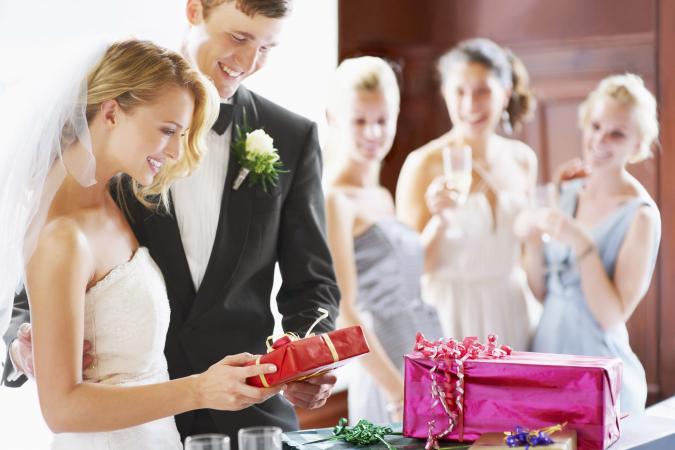 Wedding couple opening gifts