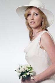 Bride in a casual wedding dress and hat