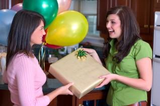 Guest giving the bride a shower gift