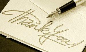 Wedding thank you note and a calligraphy pen