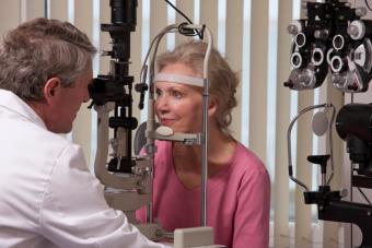 senior woman having eyes examined