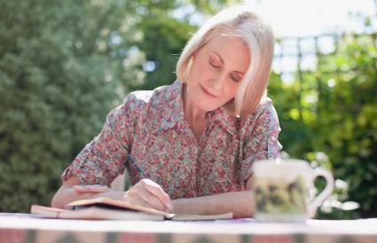 Woman writing in journal