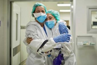 nurses hugging each other