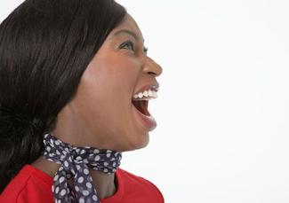 Woman doing jaw stretch.