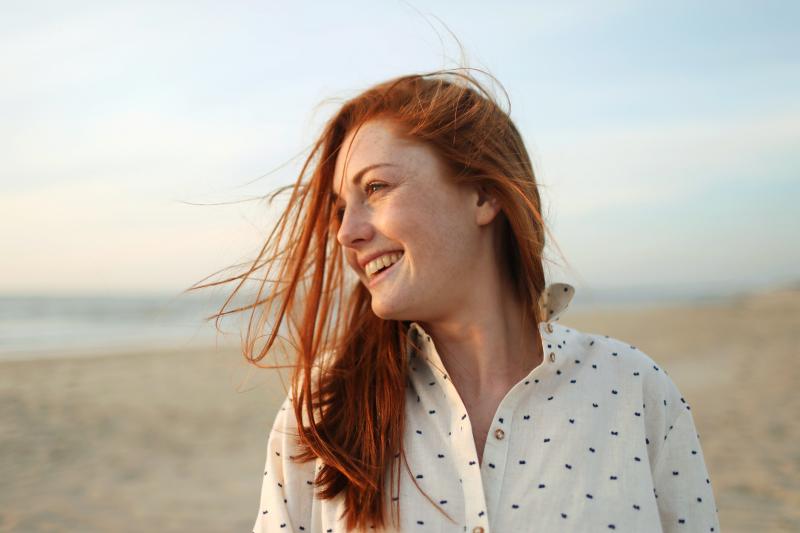Young woman smiling on the beach