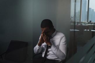 Stressed business man in office