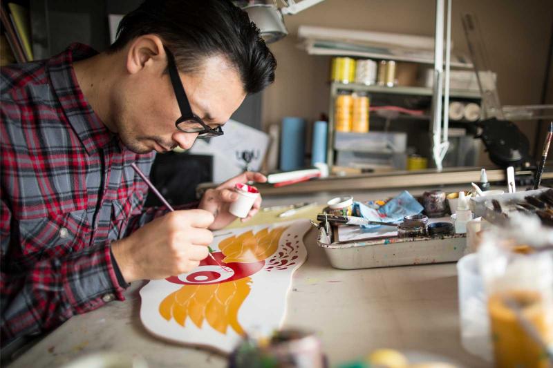 man painting for stress relief