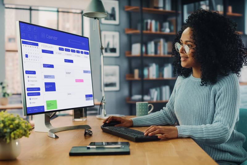 Woman Working on Desktop Computer