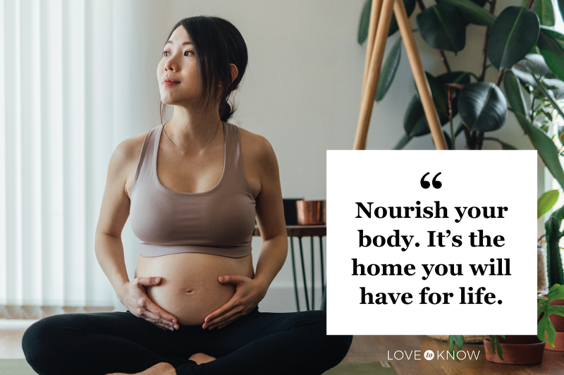 Young Asian Pregnant Woman practicing Yoga At Home