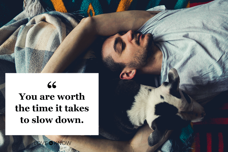 Man Sleeping On Bed At Home With Dog