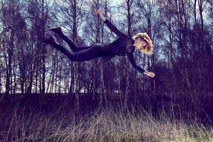 Floating woman in a field