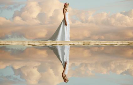 bride reflected in still lake