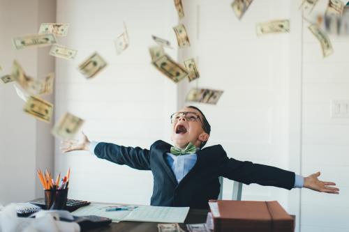 Cash raining on a boy