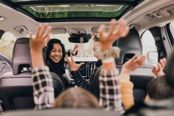 Cheerful family enjoying road trip 