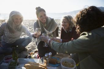 Drinking wine at a beach picnic