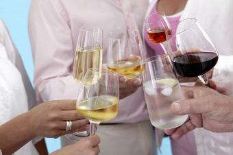 People raising wine glasses in a toast