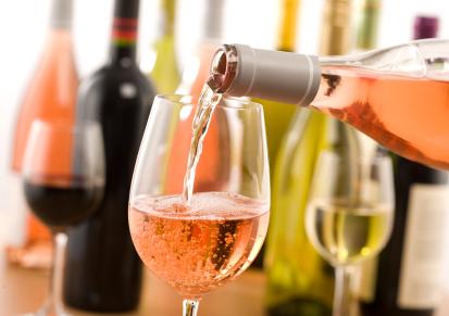 pouring blush wine