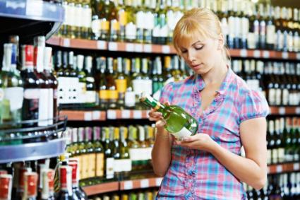 Woman shopping for sparkling wine