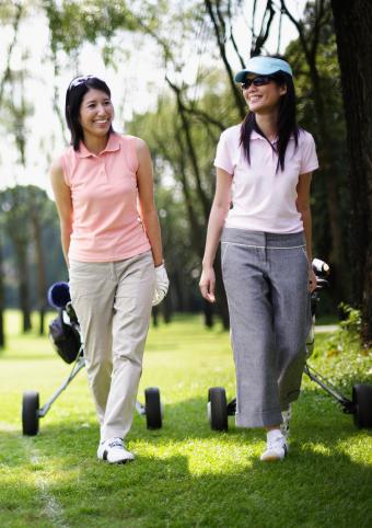 Two golf women wearing polo shirts