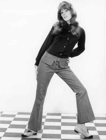 Woman posing in 1950s or 1960s era clothing