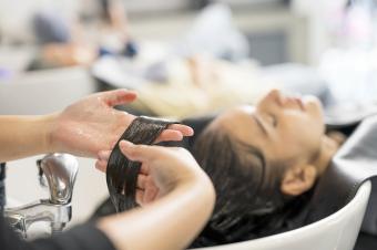 Relaxed Customers getting a hair washed by beautician at the beauty salon