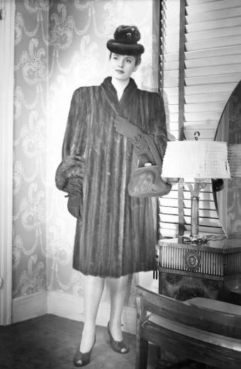 Fashionable woman in mink coat and hat