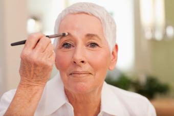 woman applying eyebrow makeup