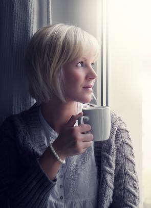 Woman in warm cardigan sweater