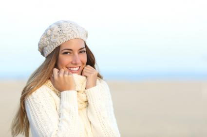 Woman wearing white sweater