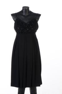 Image of an elegant black 1960s cocktail dress