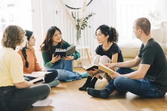 Happy people discussing a new book