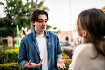 Young couple talking outdoors 