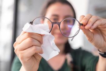 woman cleaning glasses