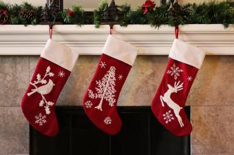 red & white stockings hung from fireplace mantel