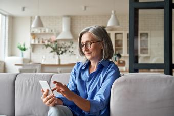 Mature woman texting on her mobile phone