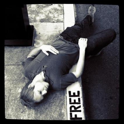 Yoga instrutor laying on the ground