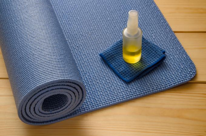 blue yoga mat with cleaner